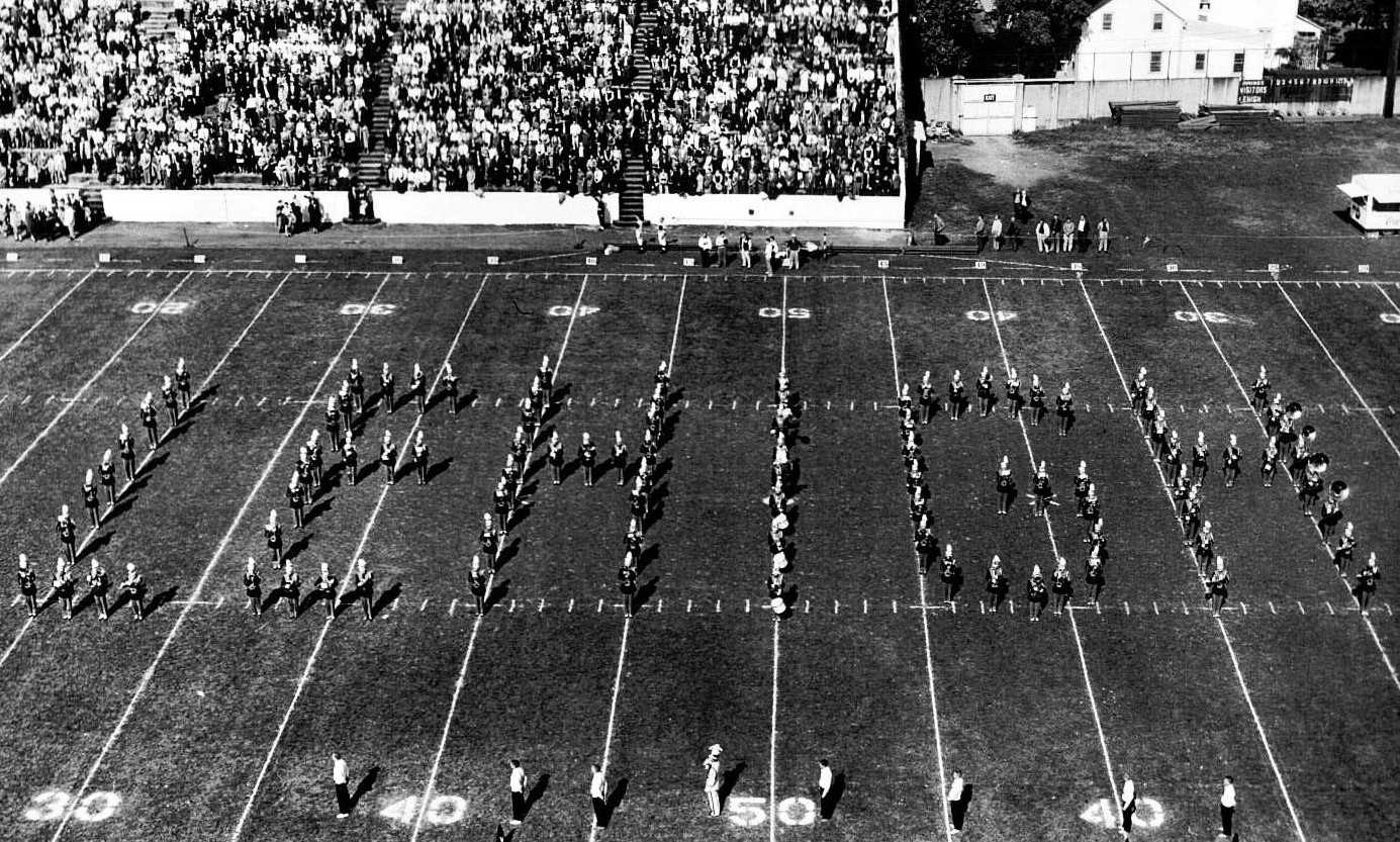 The band spells out Lehigh in uppercase letters on the football field