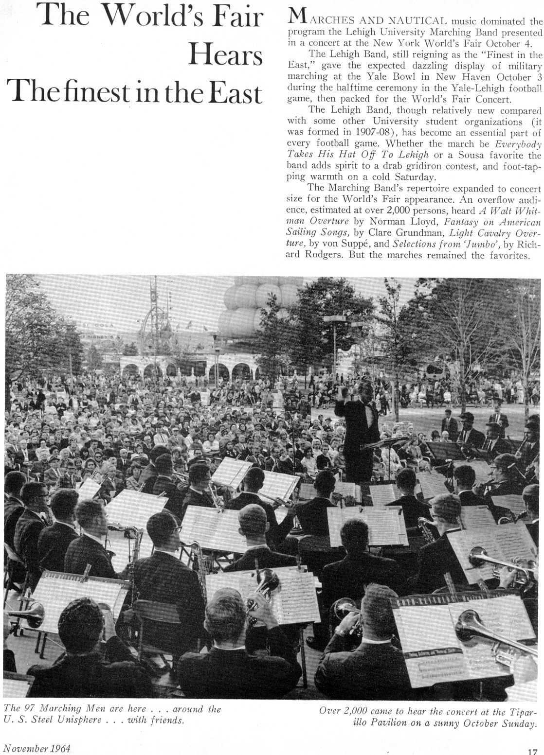 The band, dressed in suits and ties, plays onstage for a very large crowd