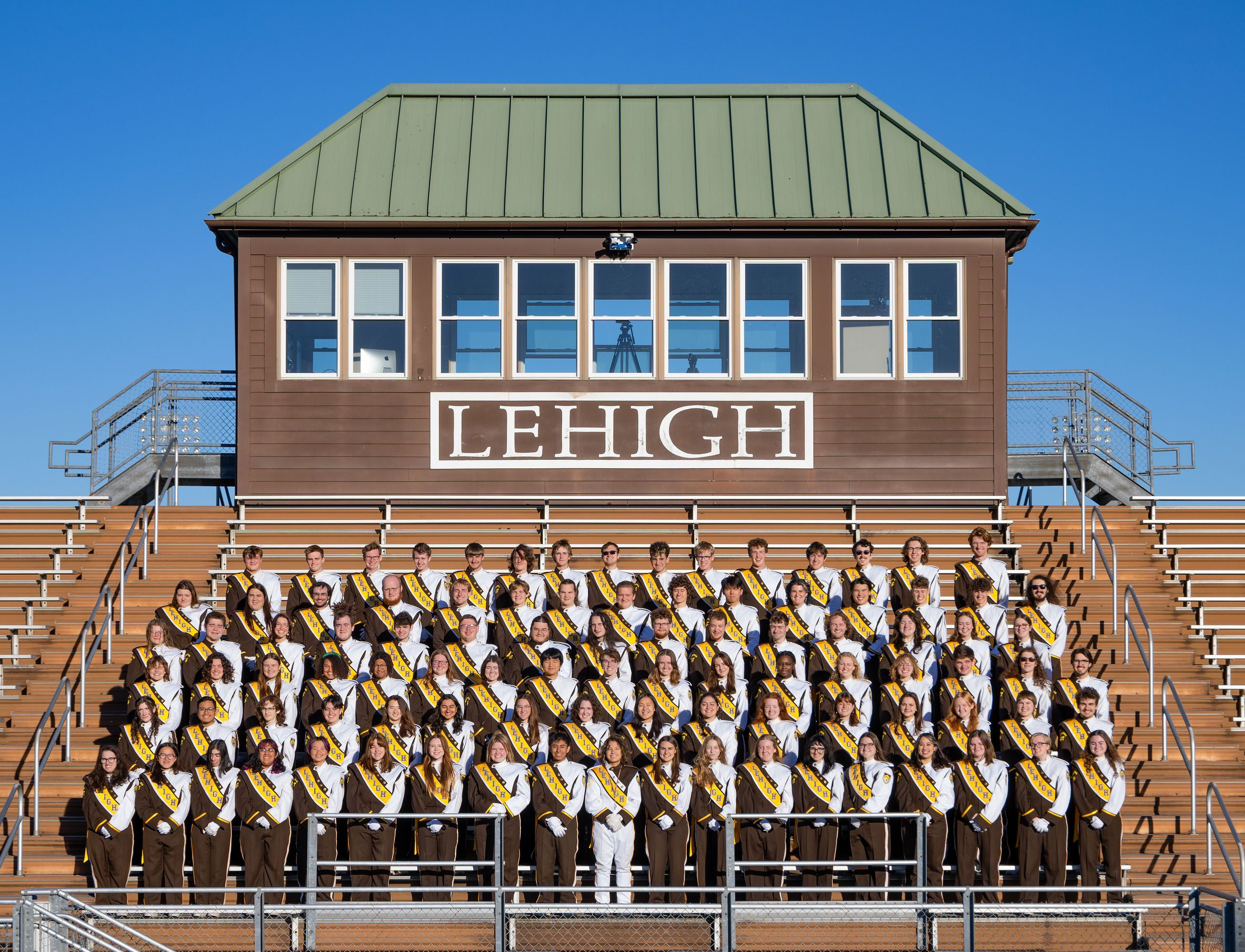 The entire band in uniform in the stands