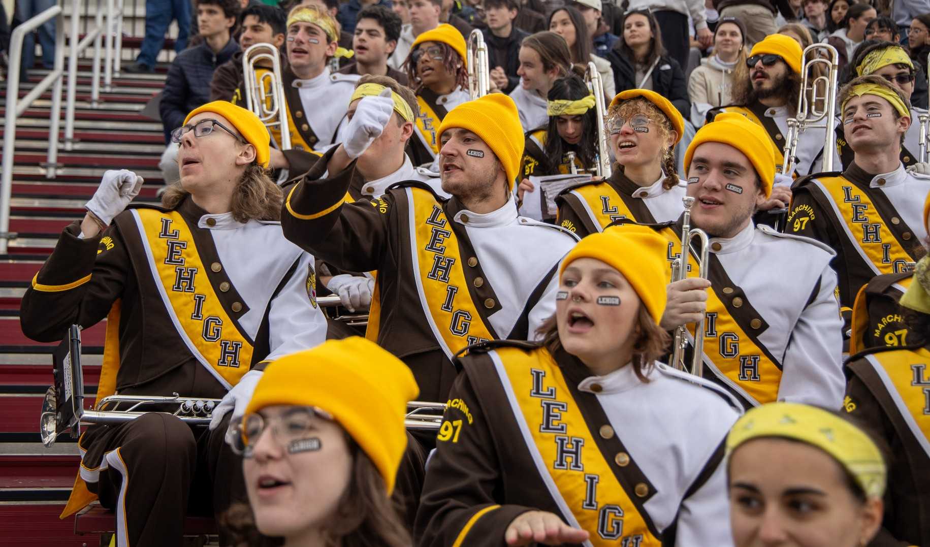The band cheering on the football team from the stands