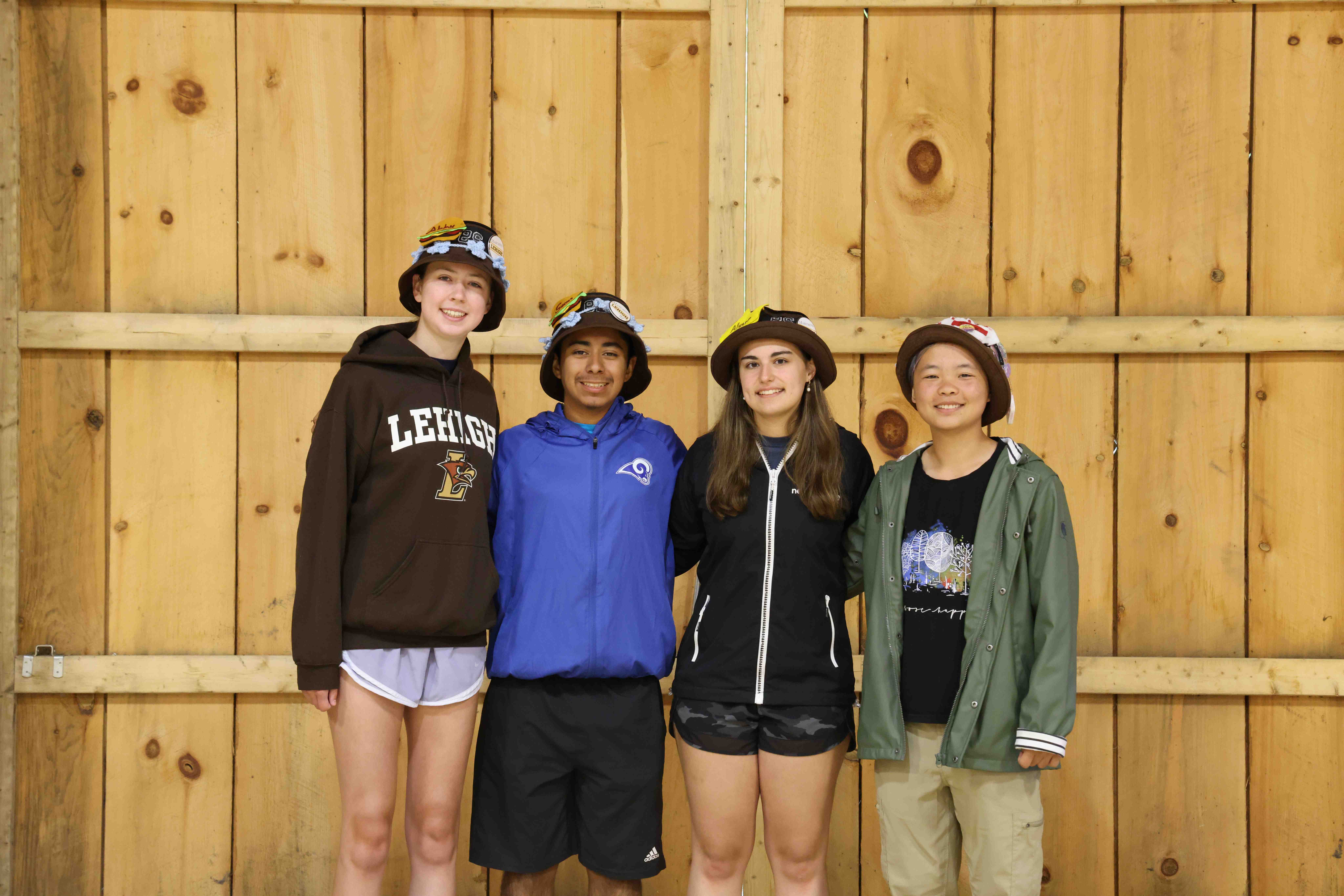Rank 4 smiling with their arms around each other at band camp.