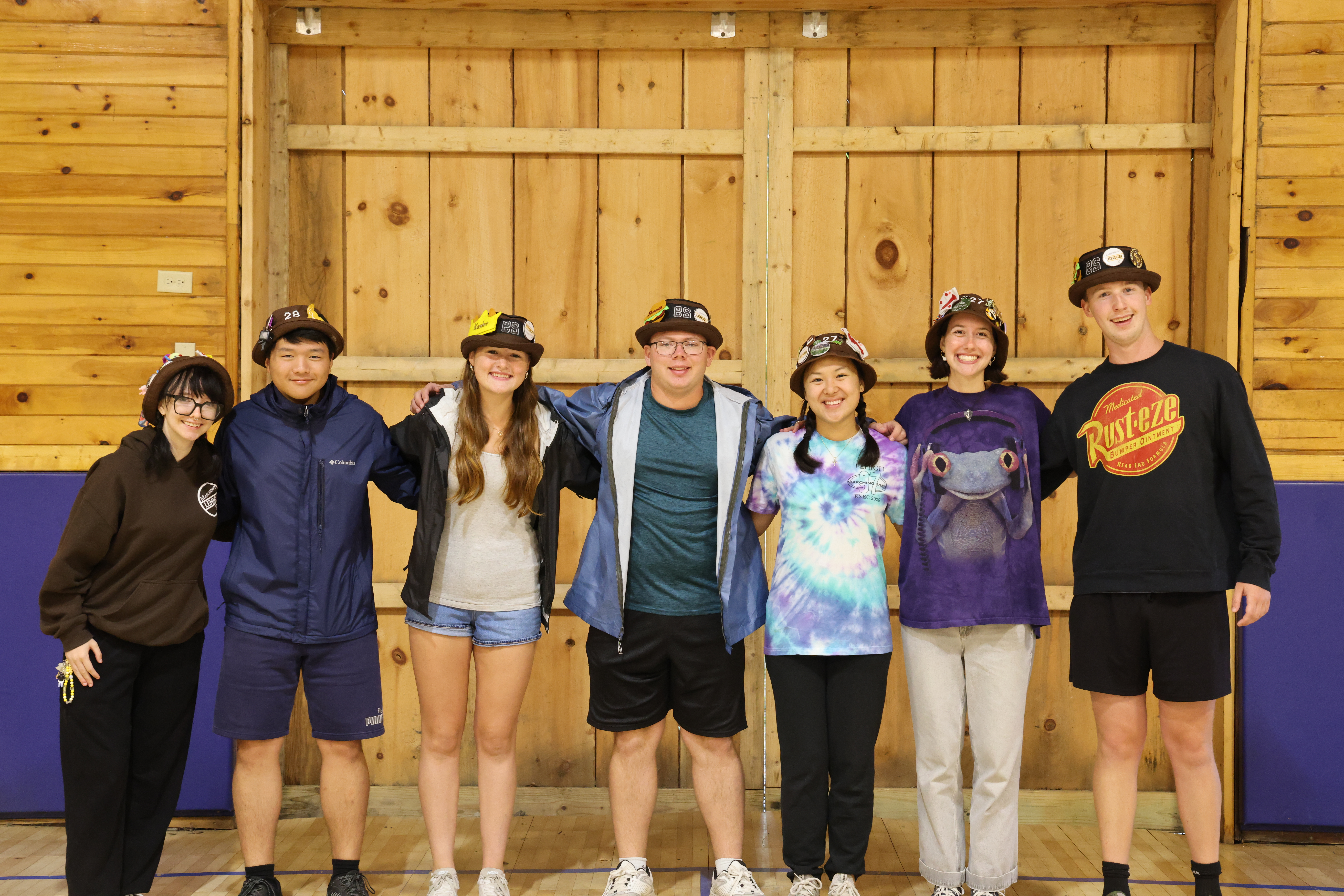 Rank 8 smiling with their arms around each other at band camp.